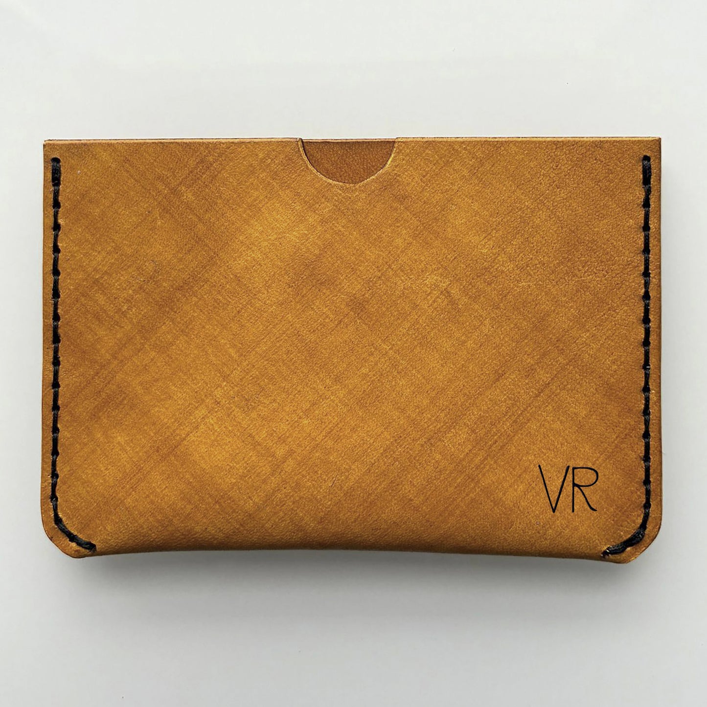 an example of a yellow engraved card wallet on a white background