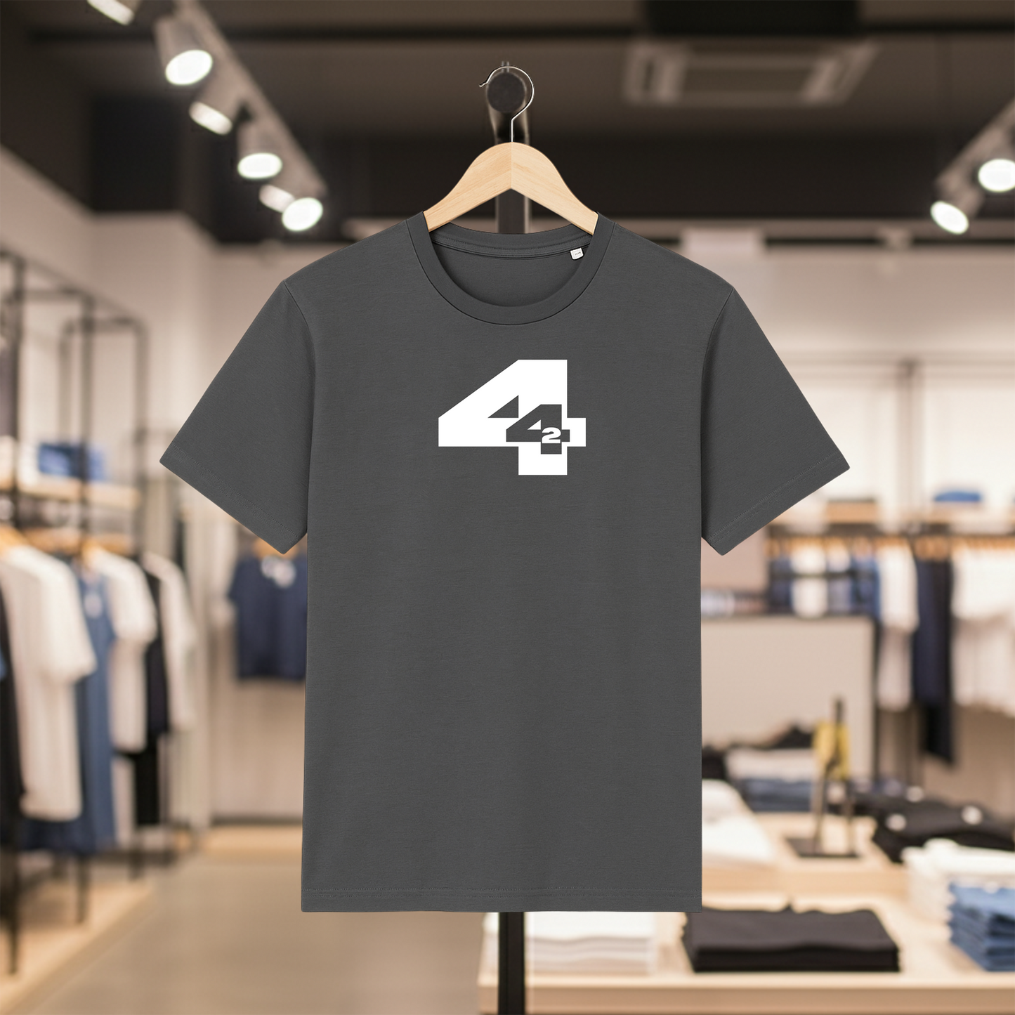Grey t-shirt with a white  '442' design on a hanger in a store setting