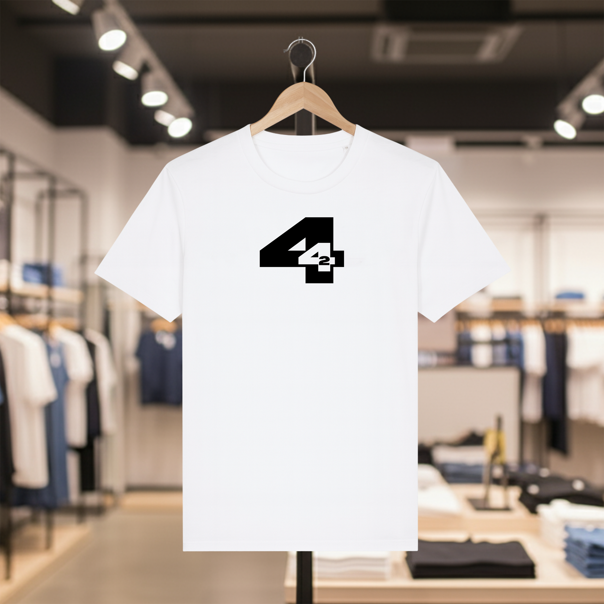 White t-shirt with a white  '442' design on a hanger in a store setting
