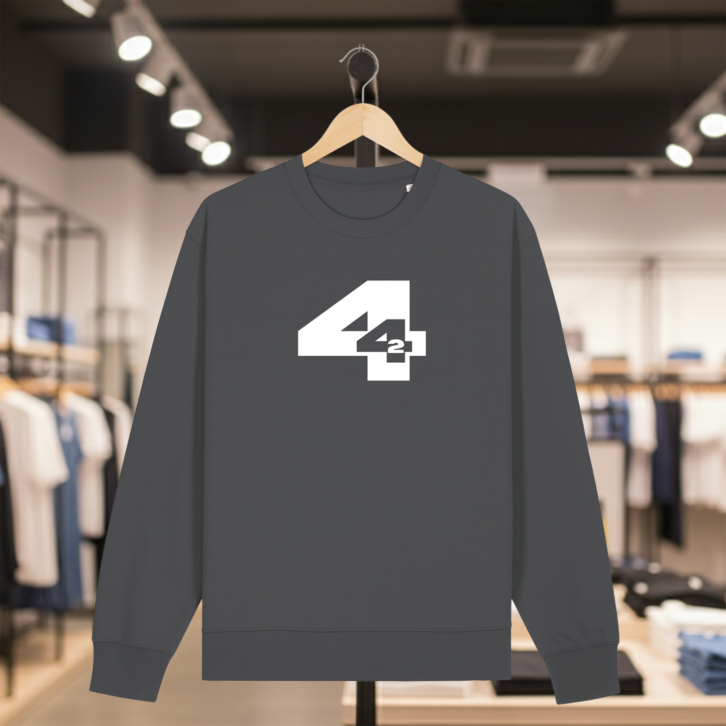 Grey sweatshirt with 442 design on a hanger in a store setting