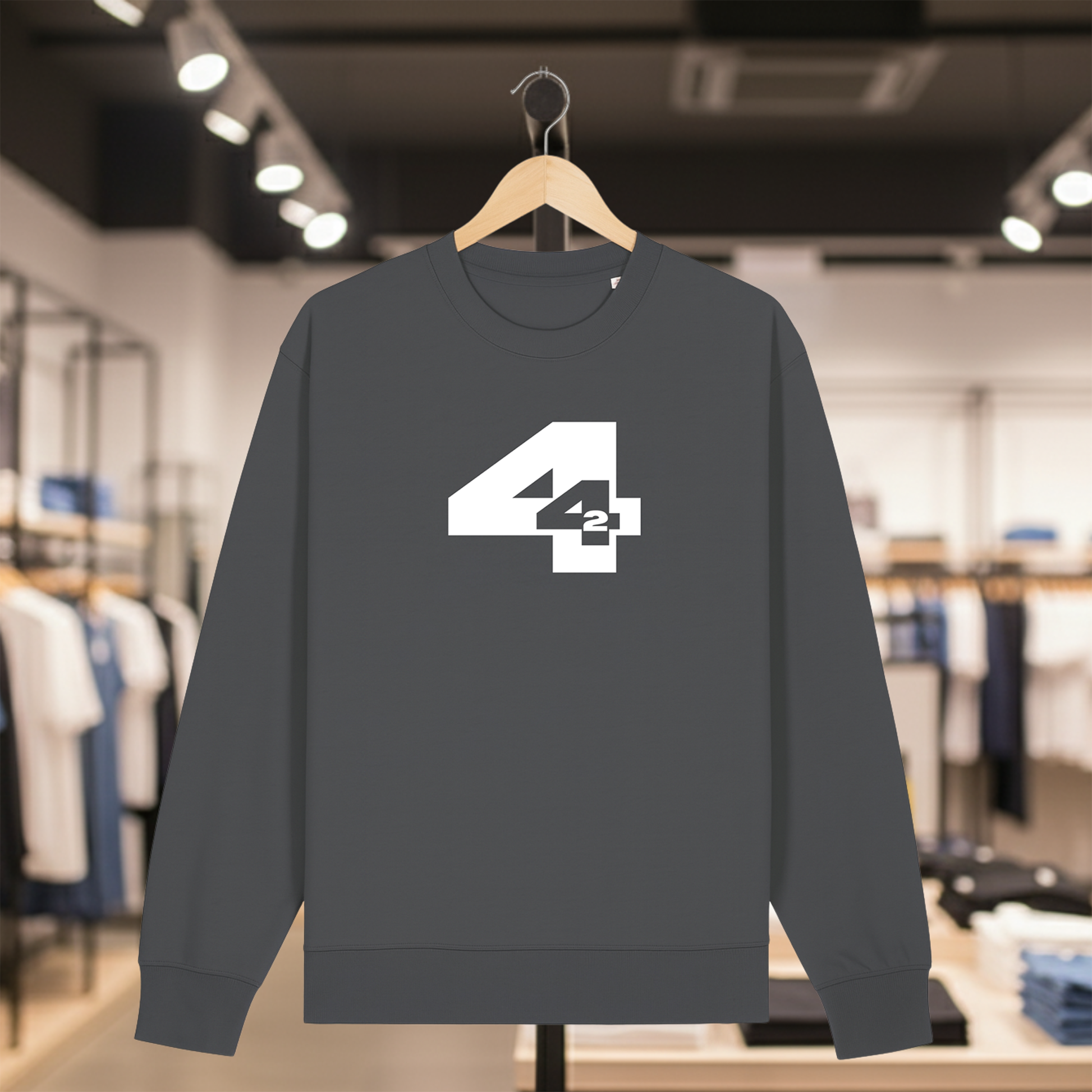 Grey sweatshirt with 442 design on a hanger in a store setting