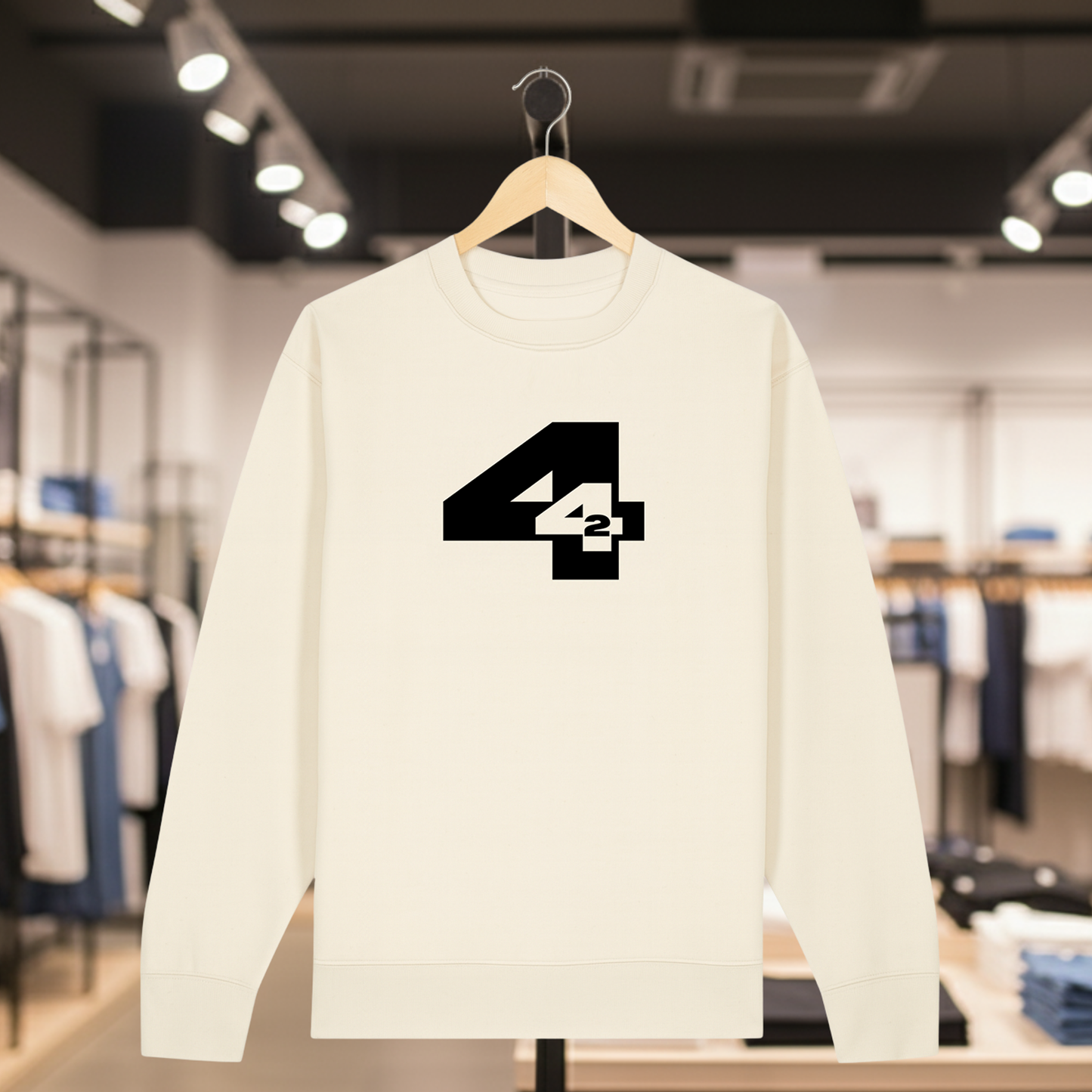 Natural sweatshirt with 442 design on a hanger in a store setting