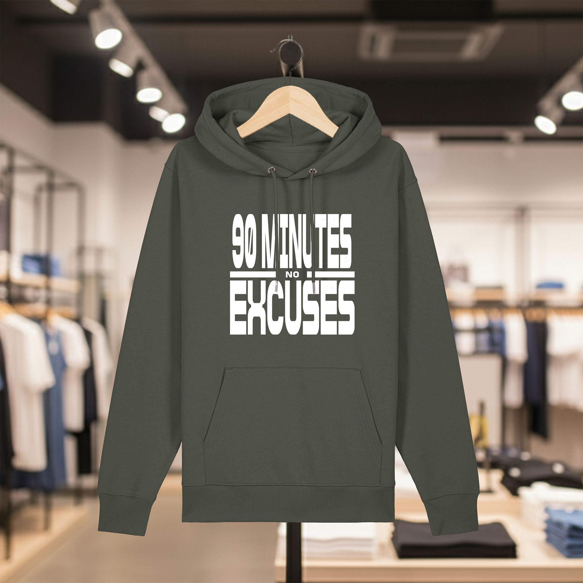 Khaki hoodie with text 90 MINUTES NO EXCUSES on a hanger in a store setting