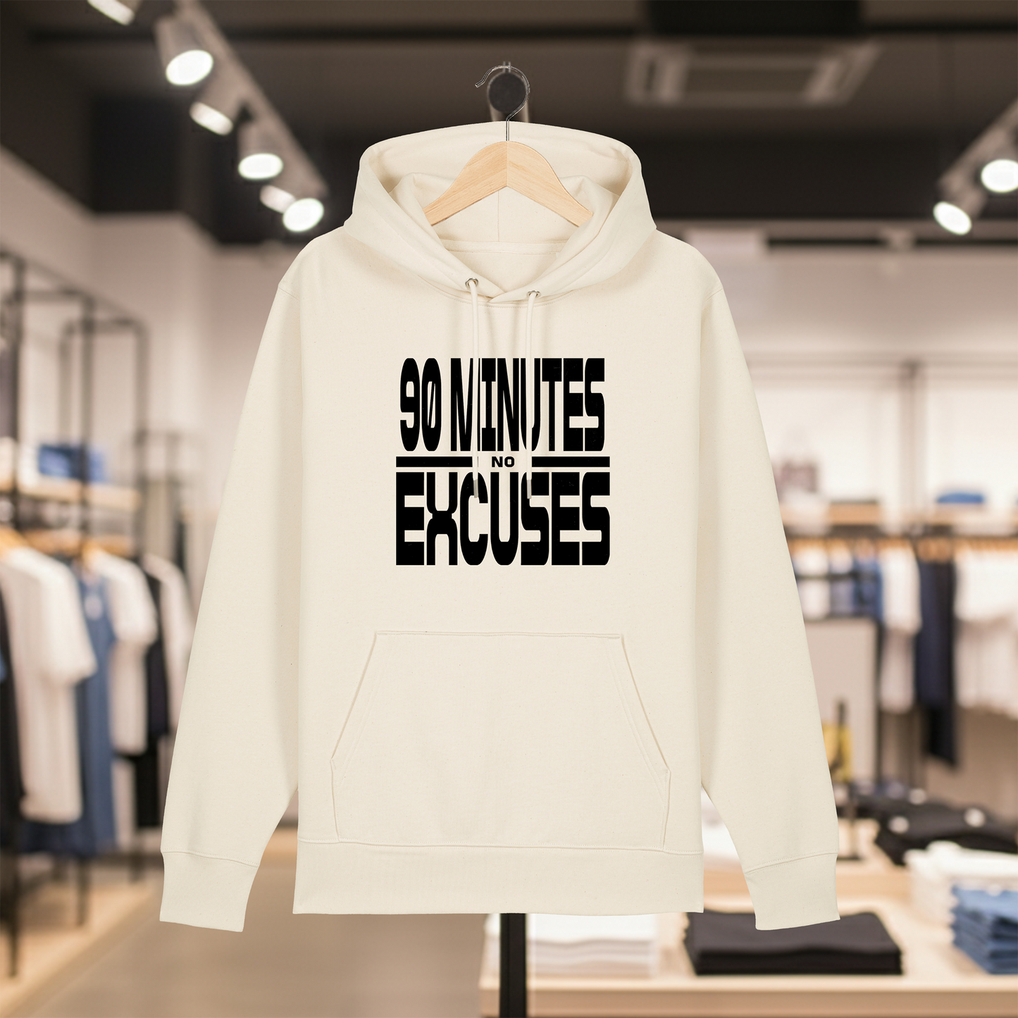 Natural hoodie with text 90 MINUTES NO EXCUSES on a hanger in a store setting