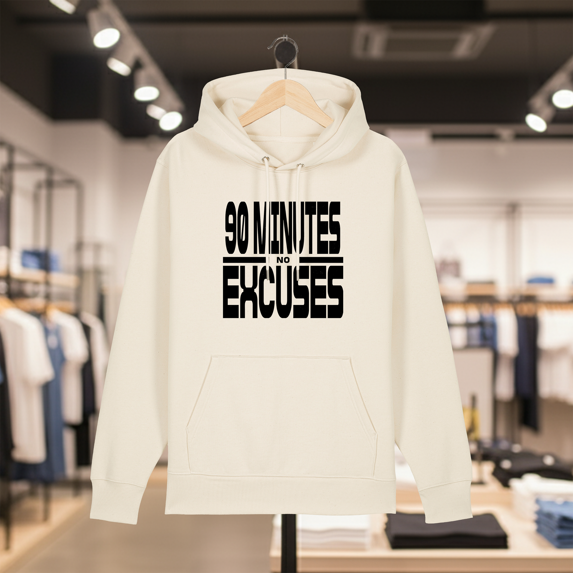 Natural hoodie with text 90 MINUTES NO EXCUSES on a hanger in a store setting