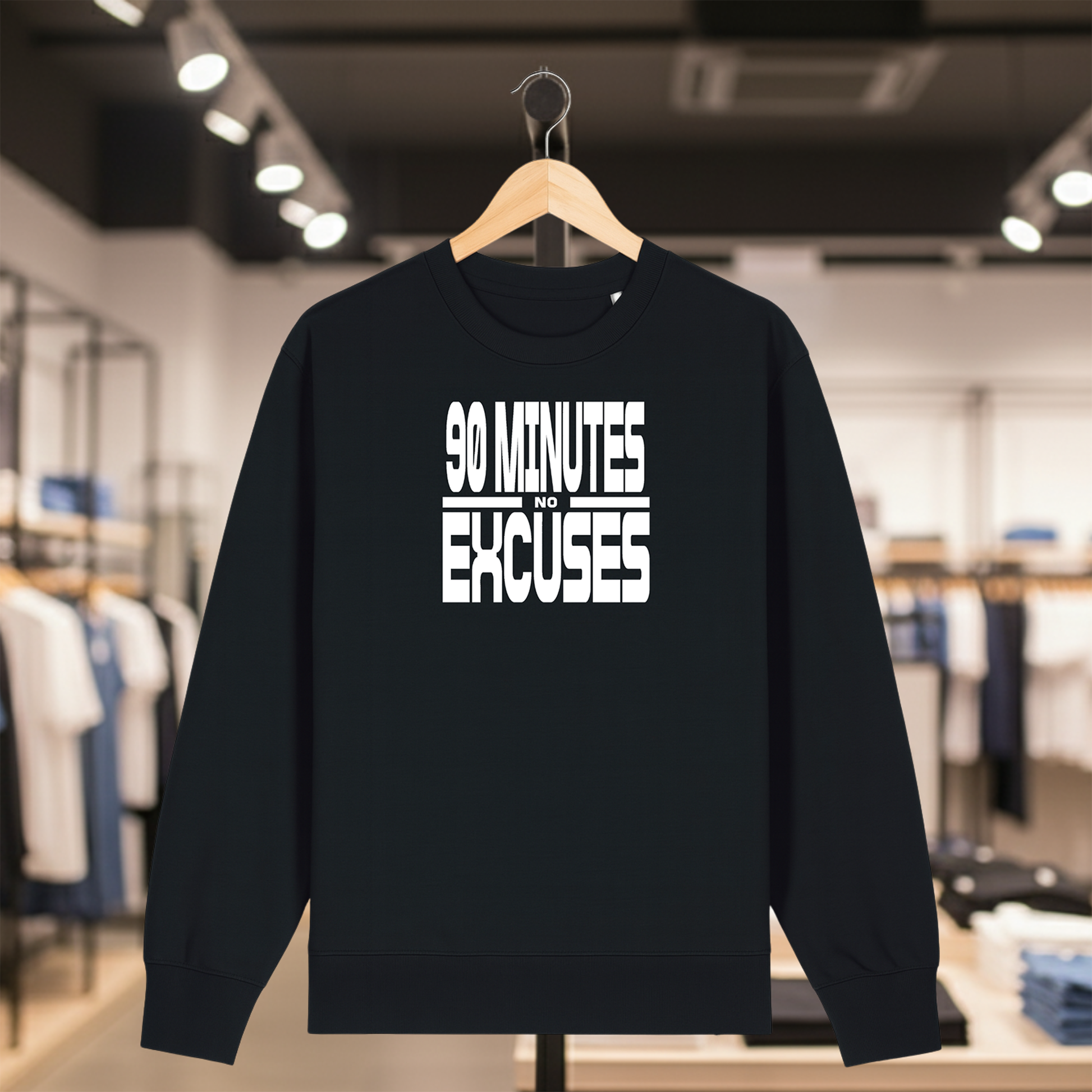 Black sweatshirt with 90 MINUTES NO EXCUSES text on a hanger in a store setting