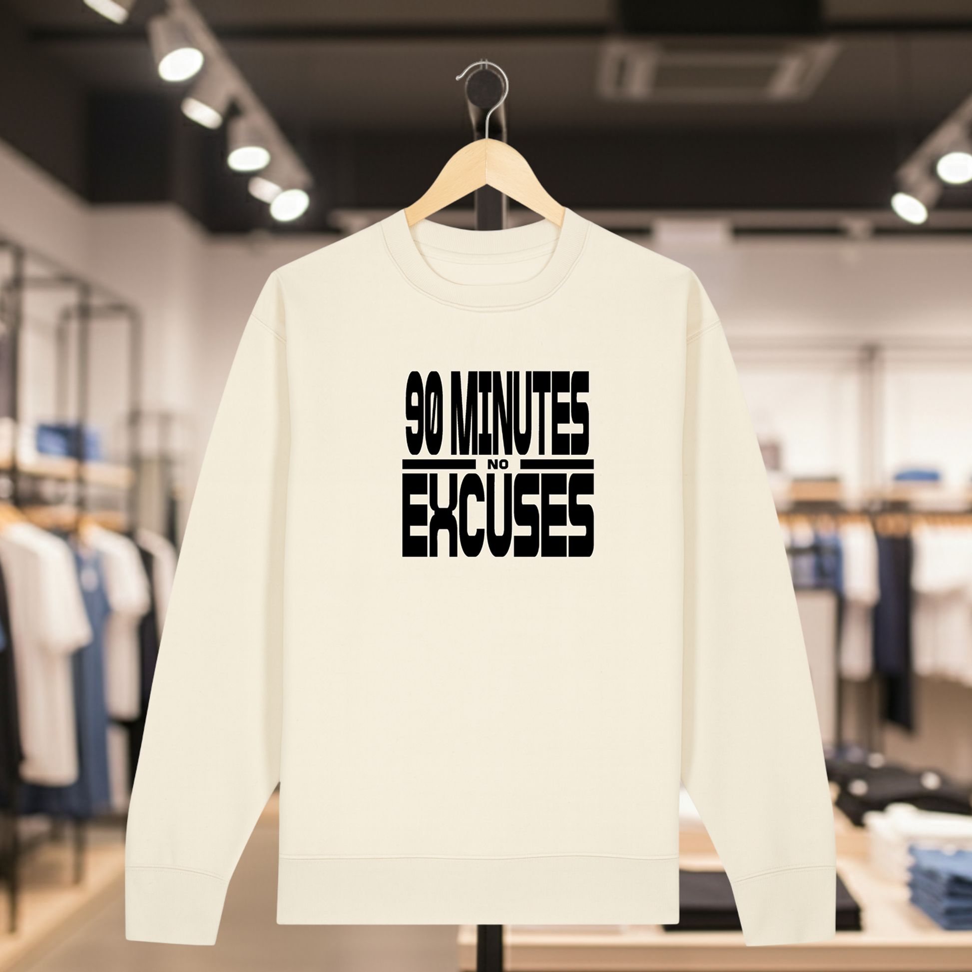 Natural sweatshirt with 90 MINUTES NO EXCUSES text on a hanger in a store setting
