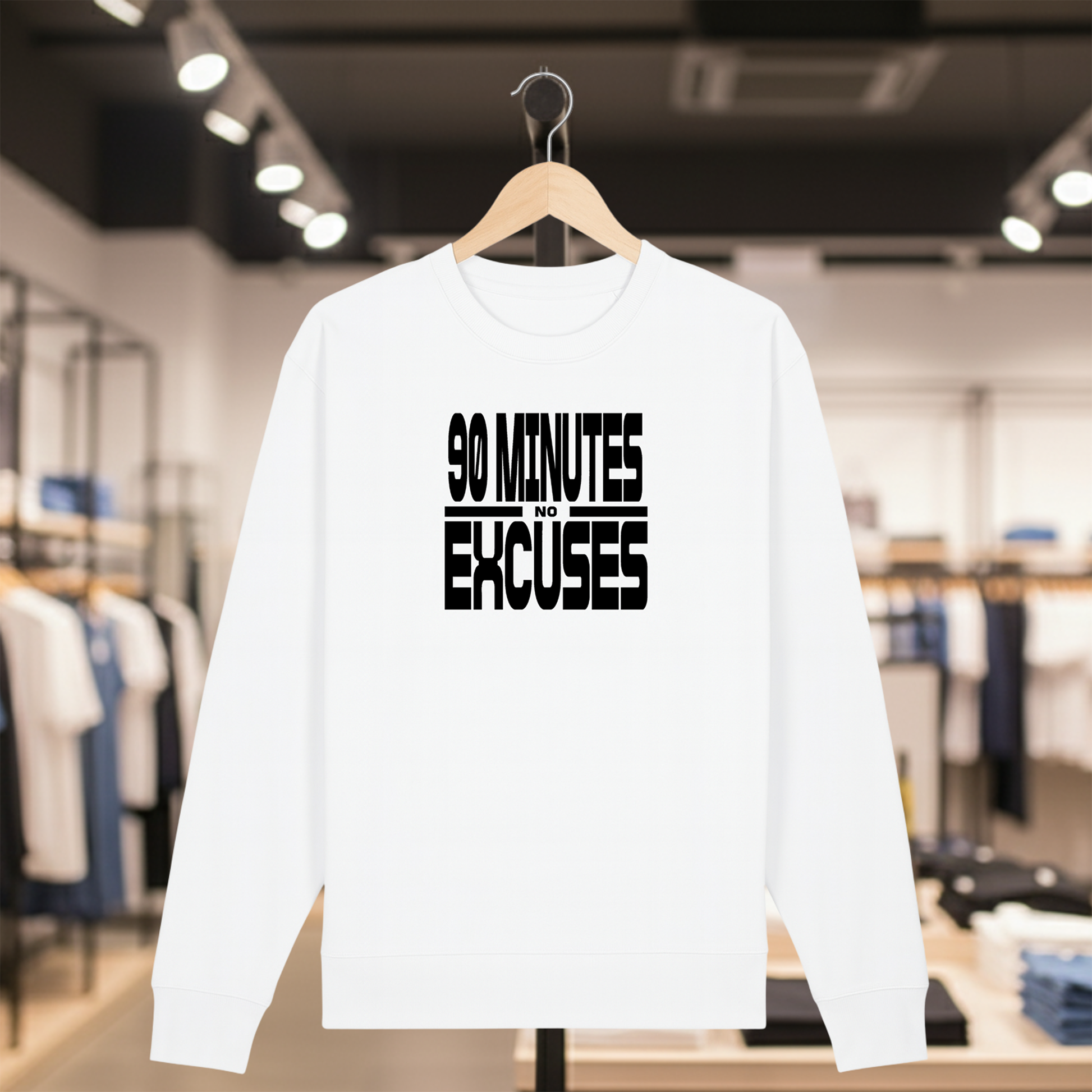White sweatshirt with 90 MINUTES NO EXCUSES text on a hanger in a store setting