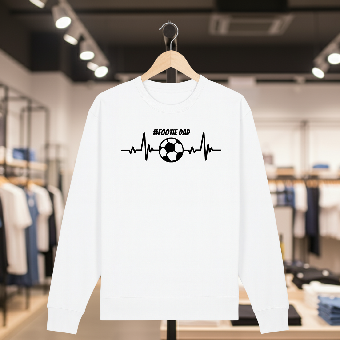 White sweatshirt with a white #FOOTIE DAD text on a hanger in a store setting