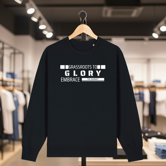 Black sweatshirt with text GRASSROOTS TO GLORY on a hanger in a store setting
