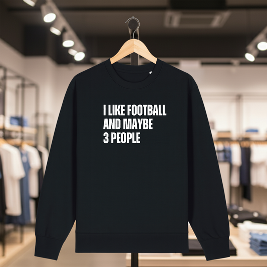 BLACK sweatshirt with text I LIKE FOOTBALL AND MAYBE 3 PEOPLE on a hanger in a store.