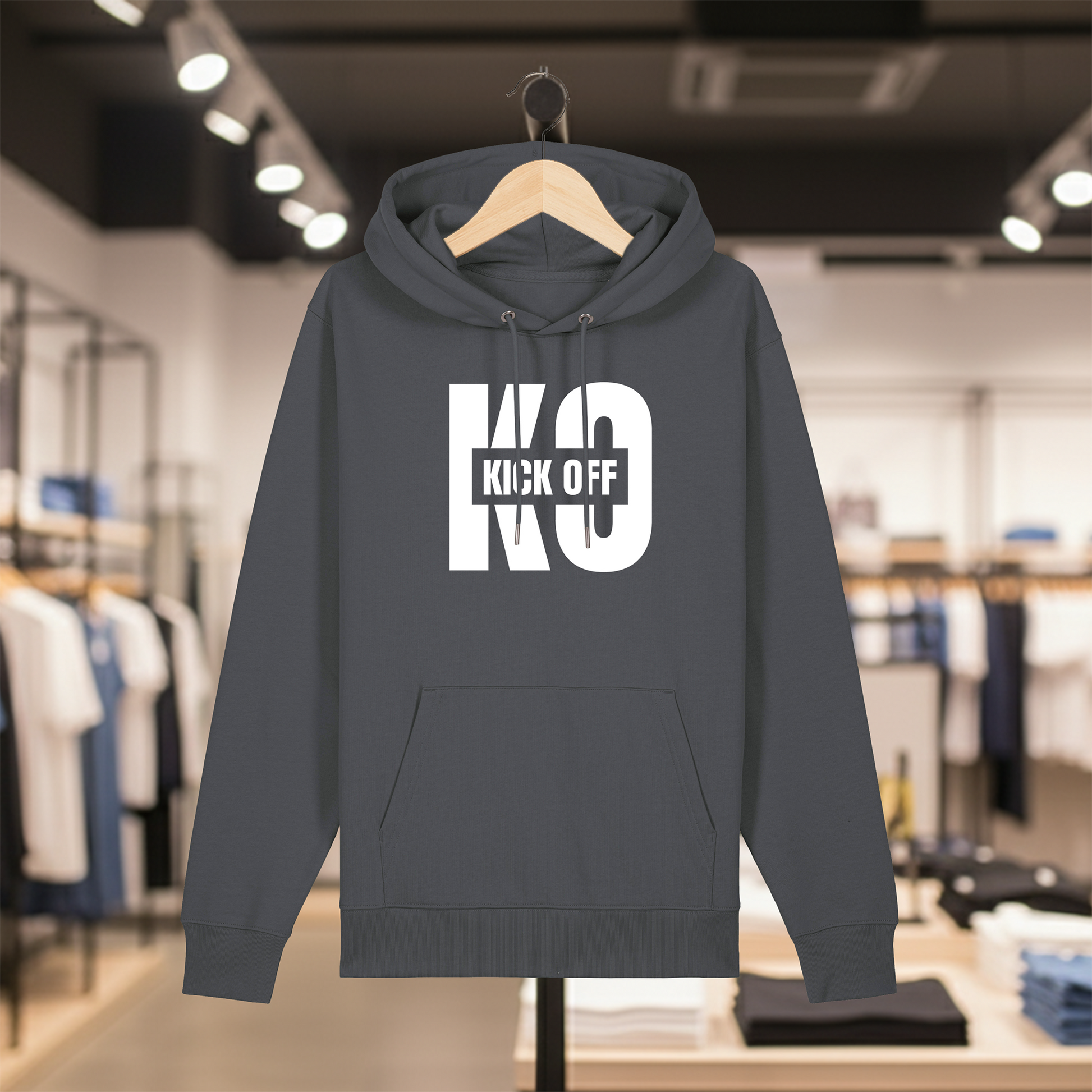 Grey hoodie with white text KICK OFF on a hanger in a store setting
