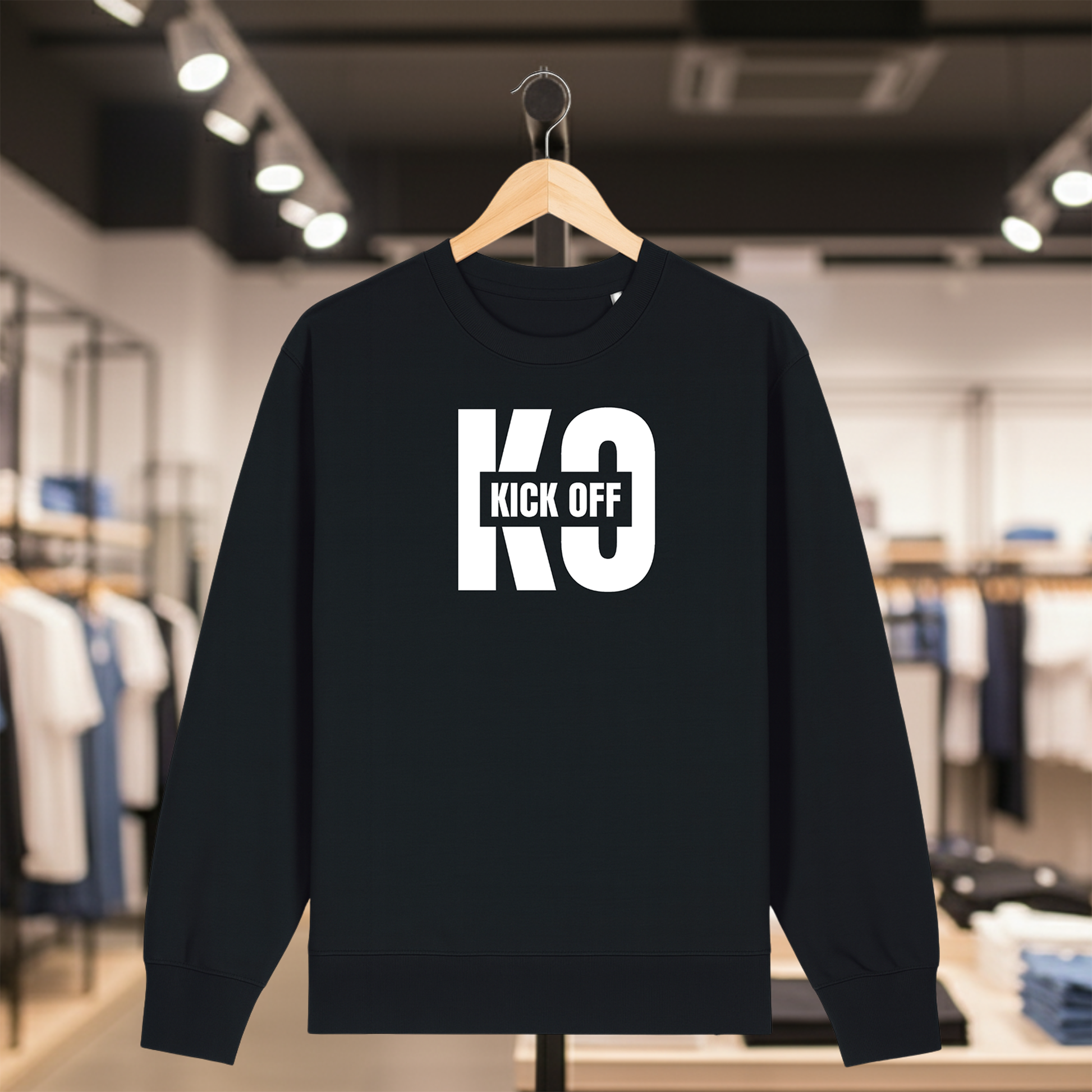 Black sweatshirt with KICK OFF text on a hanger in a store setting