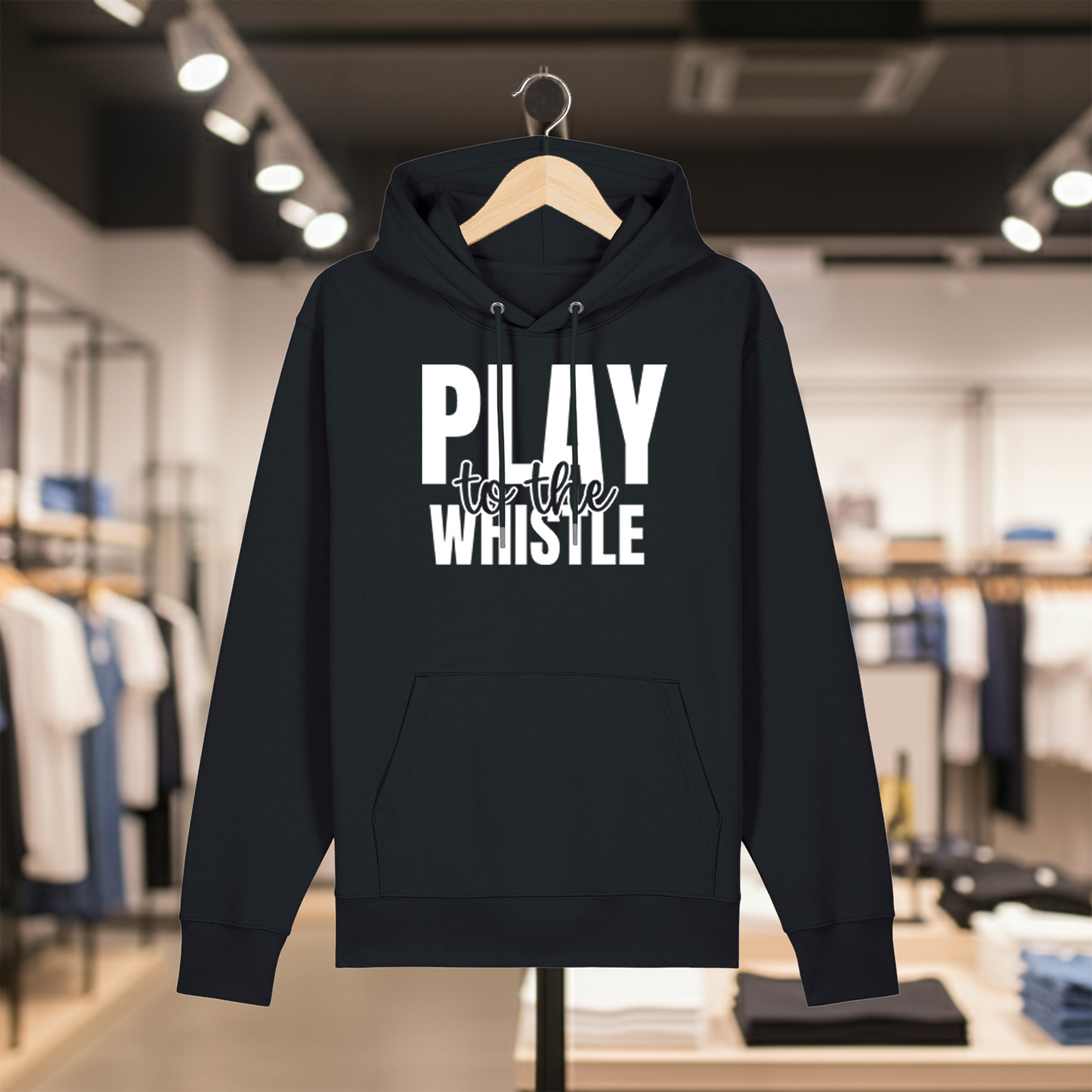 Black hoodie with text PLAY TO THE WHISTLE on a hanger in a store setting