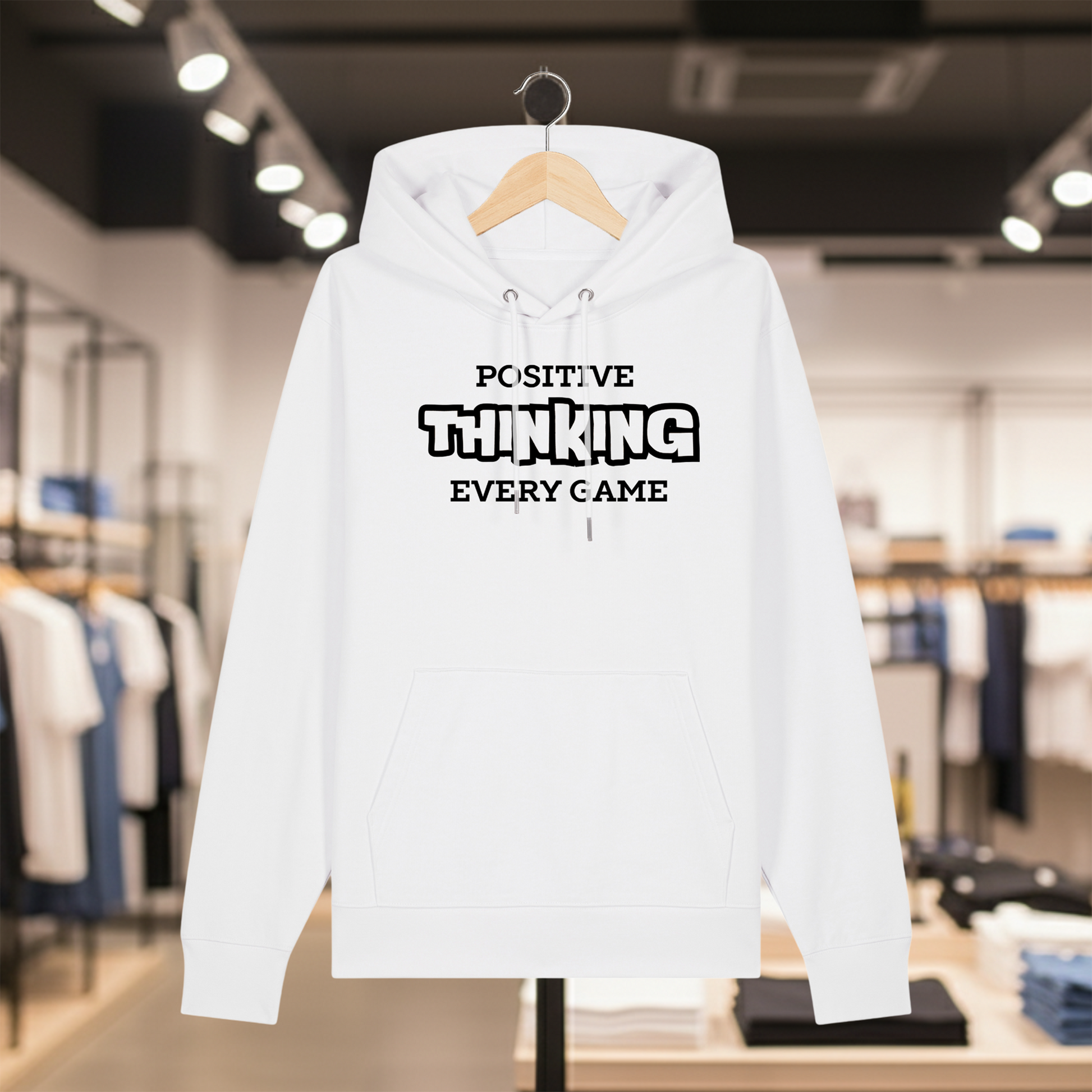 White hoodie with text POSITIVE THINKING EVERY GAME on a hanger in a store setting