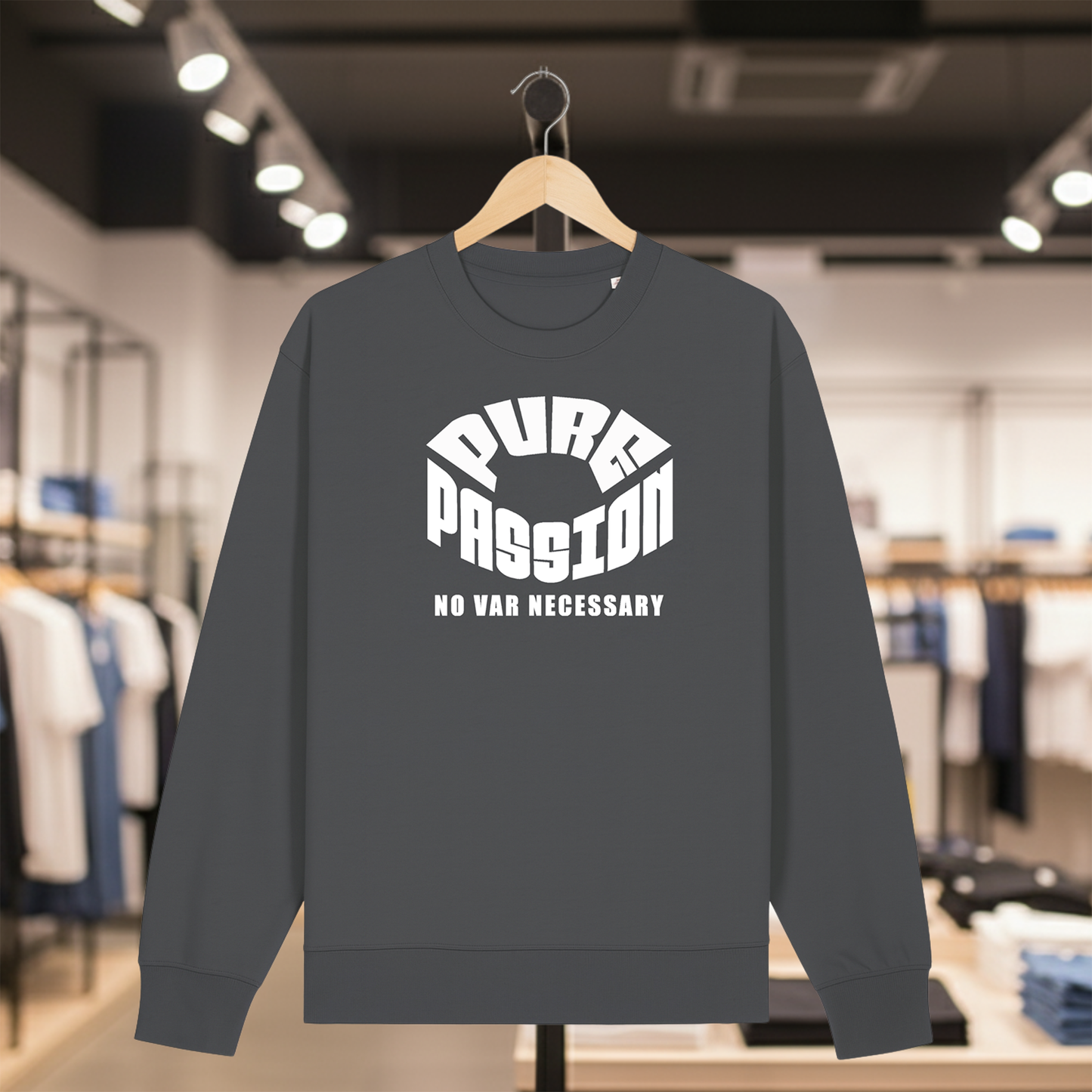 Grey sweatshirt with white text PURE PASSION NO VAR NECESSARY on a hanger in a store setting