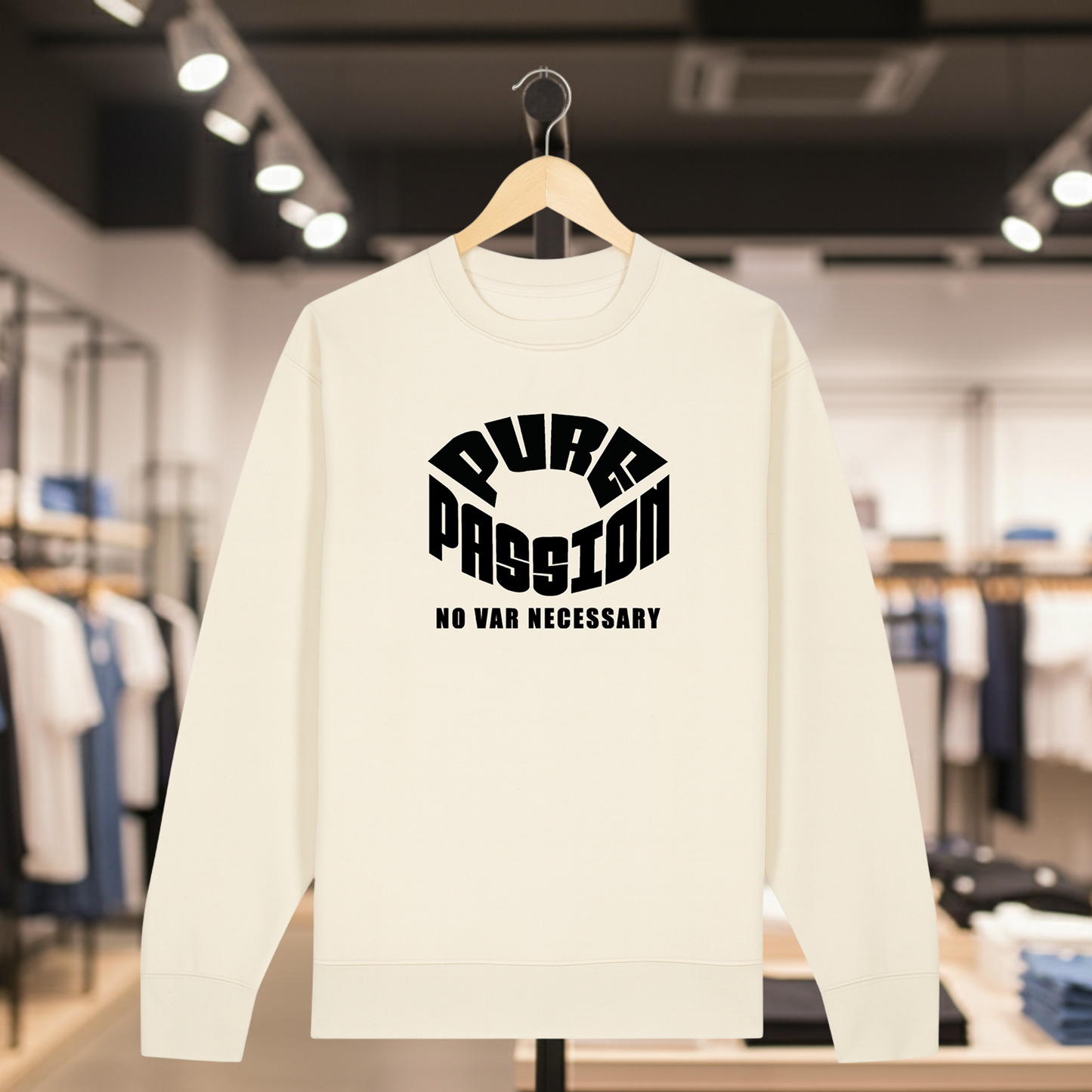 Natural sweatshirt with white text PURE PASSION NO VAR NECESSARY on a hanger in a store setting