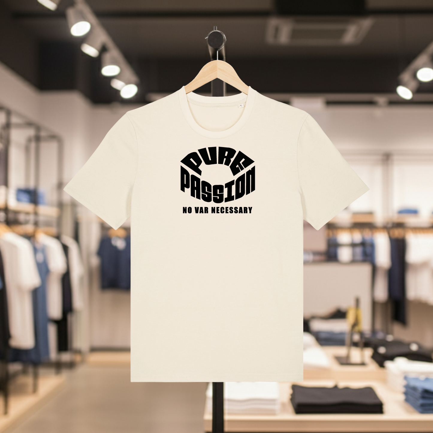 Natural t-shirt with white text PURE PASSION, NO VAR NECESSARY on a hanger in a store setting