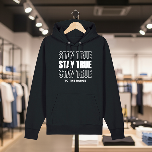 Black hoodie with text STAY TRUE TO THE BADGE on a hanger in a store setting