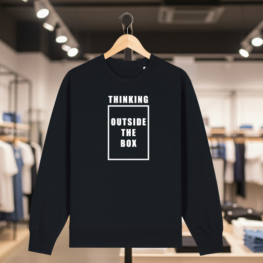 Black sweatshirt with white text THINKING OUTSIDE THE BOX on a hanger in a store setting