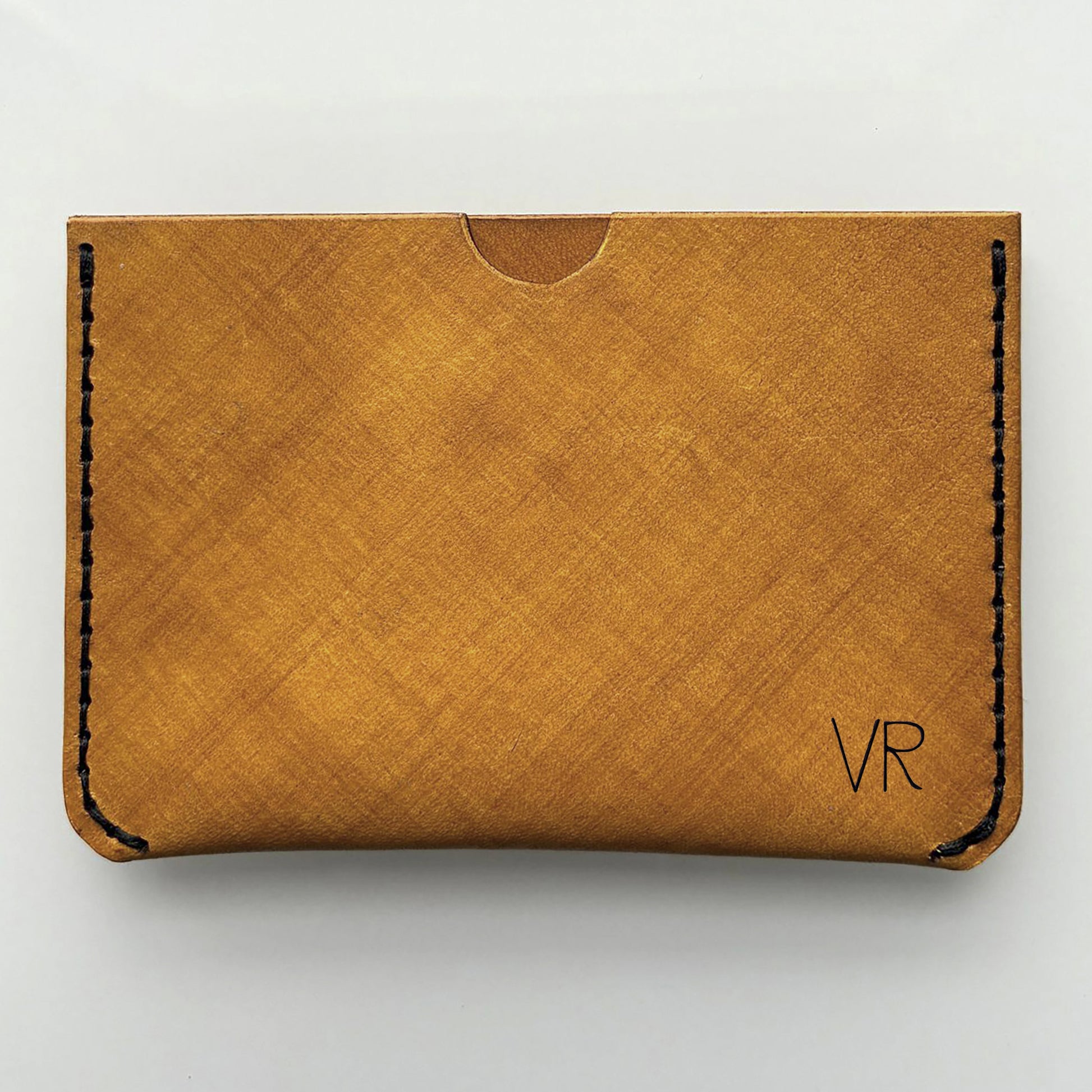 an example of a yellow engraved card wallet on a white background