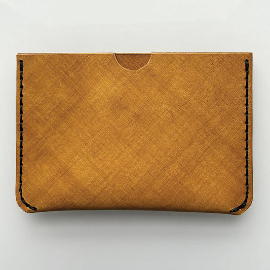 yellow leather card wallet on a bright background